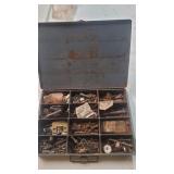 Metal container full of hardware