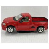 Maisto 1:21 scale model of a red Ford SVT F