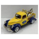 1940 Ford Pickup Truck with a towing machine,