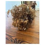 Arrangement of dried flowers in a basket Arrangement of dried flowers in a basket