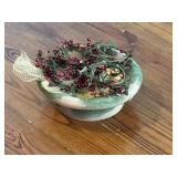 Planter filled with artificial berries and Planter filled with artificial berries and