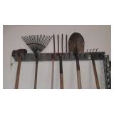 Wall rack with tools axe pitchforks Is rake Is Wall rack with tools axe pitchforks Is rake Is