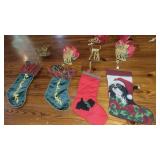 Four stockings and stocking holders Four stockings and stocking holders