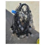 100 foot of hanging lights with bulbs most of
