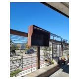 Large metal outdoor TV box with hydraulic door on