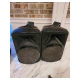 Two outdoor speakers use have been outdoors for a