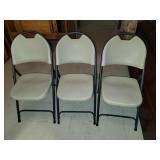 Three folding chairs