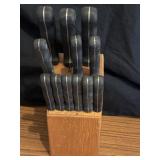 12 Piece stainless steel cutlery set with a wood