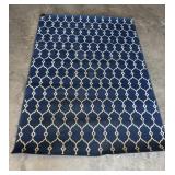 63'x88' Blue Area Rug Featuring a Cream
