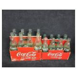 (16) Empty Coke Bottles