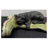 Black Labrador Laying On A Boot Figurine