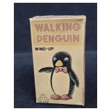 Wind-up Walking Penguin Toy with its