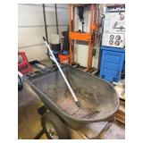 Wheelbarrow and rake