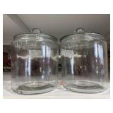 Two glass jars with lids approximately 1 gallon