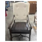Armchair with a High  Upholstered Backrest with