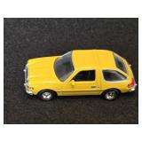 Tomica Pocket Car Diecast Model of a Yellow AMC