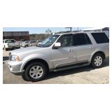 2003 Lincoln Navigator silver 4-door suv,