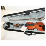 violin in case, appears to be new