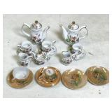 assorted miniature tea set components, mostly