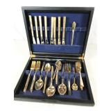 gold-tone flatware in case
