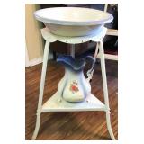 ceramic pitcher and bowl on metal stand