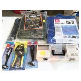 tarps, leather punch, tie downs, straps, bungie