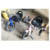 pair of Schwinn tricycles
