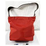 Tumi zipper-top canvas handbag in red, with