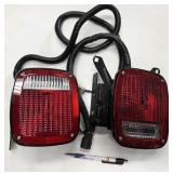 General Motors tail lights, one is marked