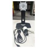 monitor stand, power cords, security camera