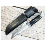 Buck 119 fixed blade knife with leather sheath,