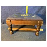 Needlepoint footstool-note rip in photo