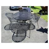 Black Iron Table w/4 Chairs(will hold an umbrella)