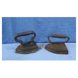2 Vintage Cast Iron Sad Irons, one Geneva &Brass