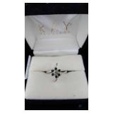 18K White Gold Ring with Six Green and One White S