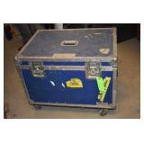 Blue traveling case on wheels