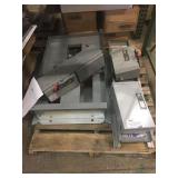 Assorted breaker boxes and parts.