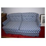 Blue and white loveseat