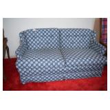 Blue and white loveseat