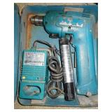 Makita electric drill w/ battery, charger, and box