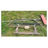 Large bow saw, measure stick, snw shovel, etc.