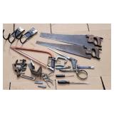 Lot of saws, hooks, tools.