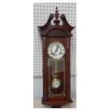 Beautiful wall clock with key and pendulum