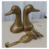 Pair of brass duck head bookends and moose towel