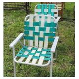 2 green and white aluminum lawn chairs