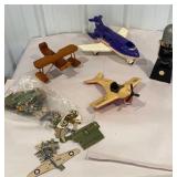 3 toy airplanes, cordless electric drill, paper