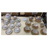 2 tea sets - one missing a teacup