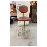 Orange upholstered industrial adjustable chair -