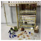 Small mirrored showcase with tiny glass animals