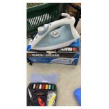 Green basket lot 3 irons, sewing kit, grabber